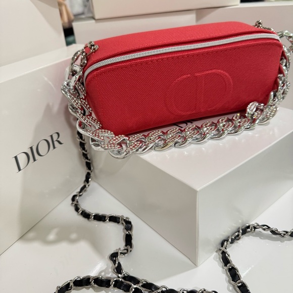 Dior beauty red mini crossbody bag with black faux leather...